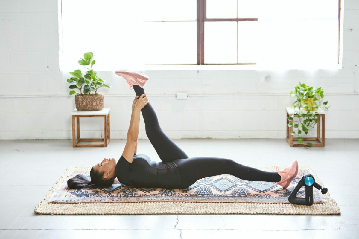 Stretching Techniques and Tips, female on floor stretching, open space in large apartment