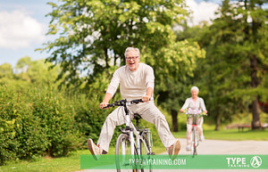 Daily Squats for Seniors, male older adult riding a bike, have fun with his partner