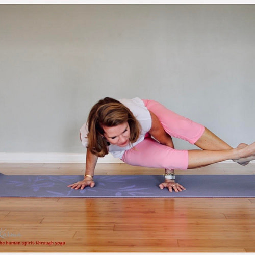 a woman doing yoga on a mat