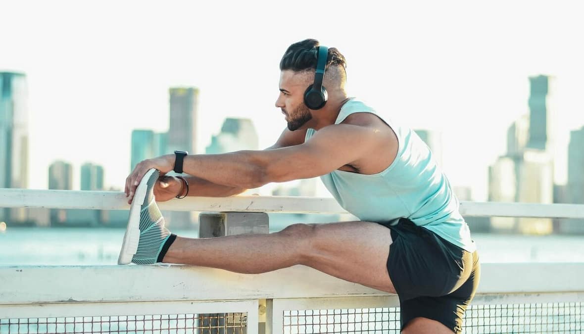 a man stretching his leg