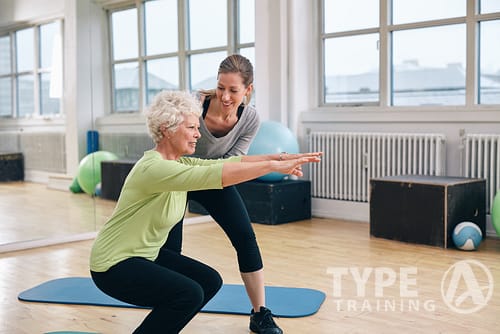 Elderly,Woman,Doing,Exercise,With,Her,Personal,Trainer,At,Gym.