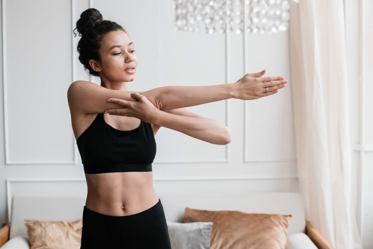 Incorporating Stretching into Daily Routine, female stretching morning routine at home