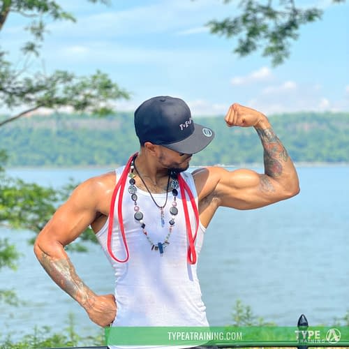 a man flexing his arm muscles