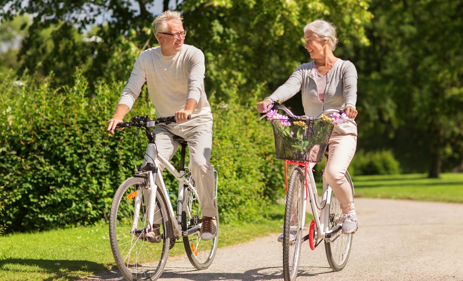 a man and woman riding bicycles