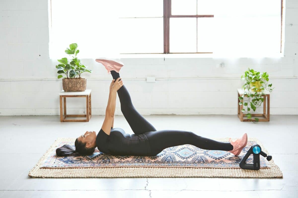 Stretching Techniques and Tips, female on floor stretching, open space in large apartment