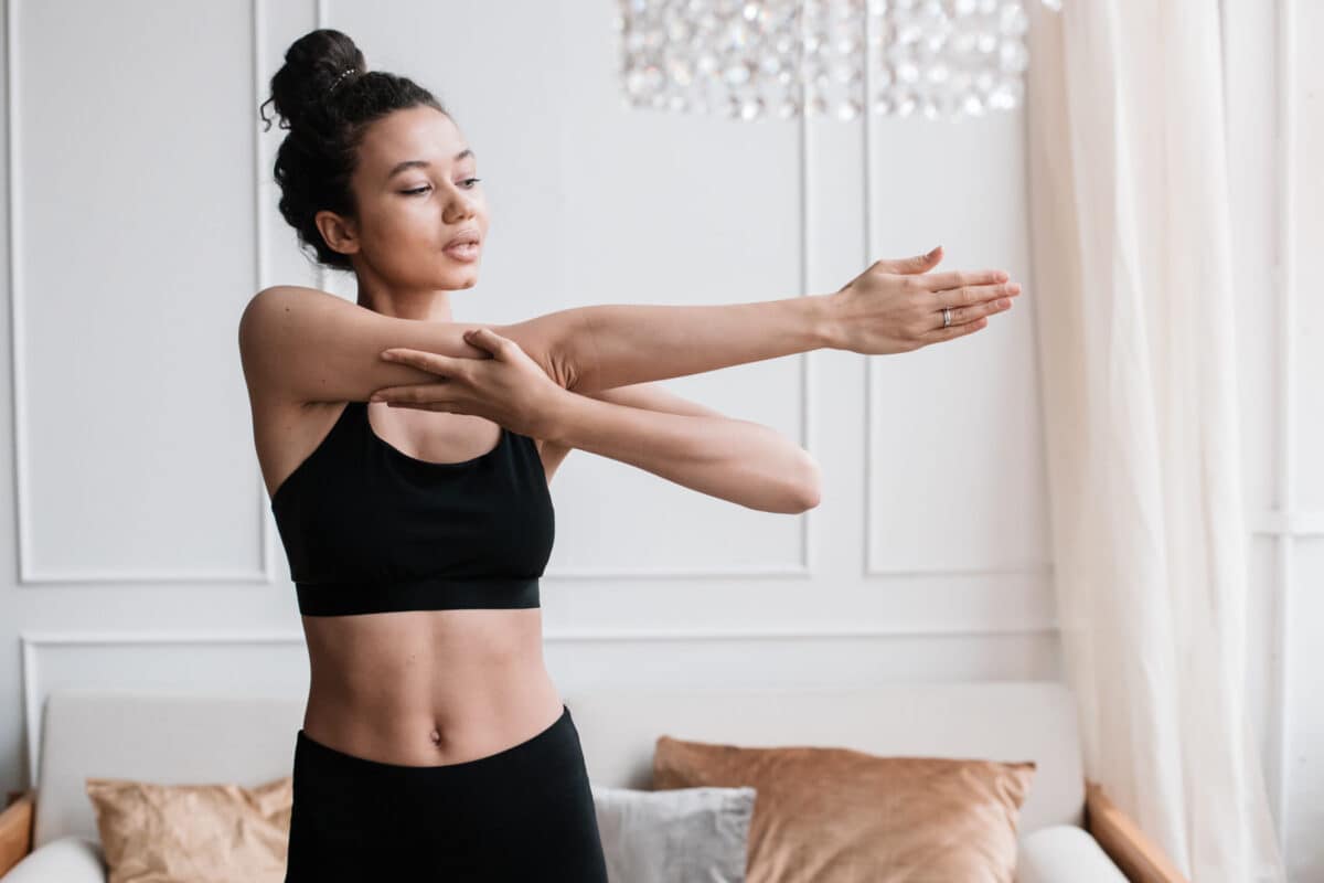 a woman stretching her arms