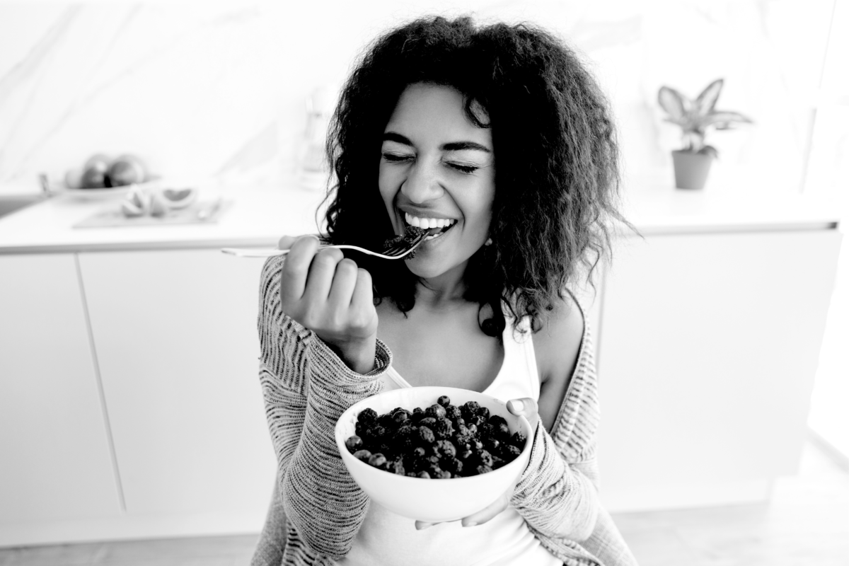 female eating a healthy fruit salad for weight loss